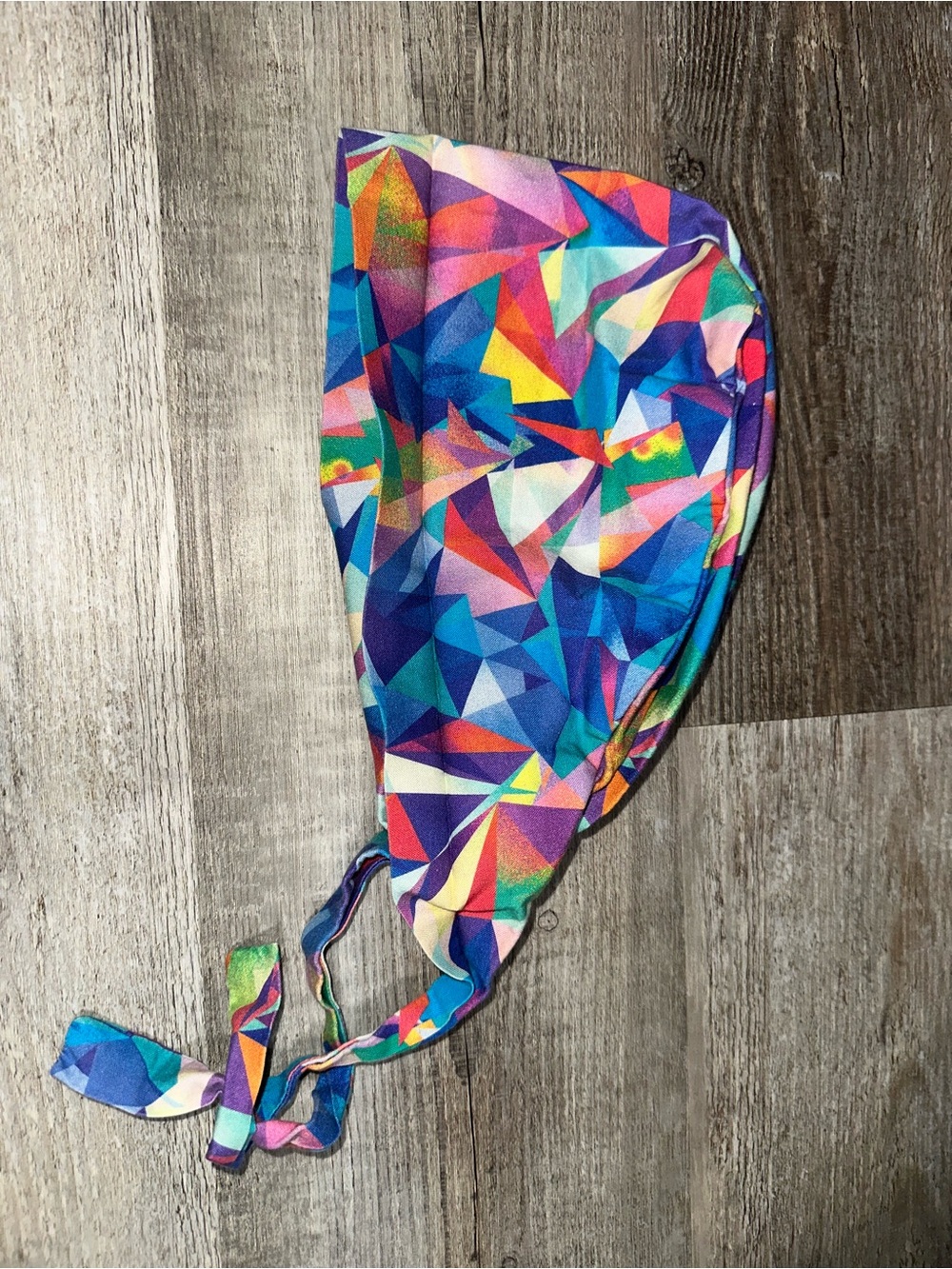 Geometric shape tie-back surgical cap